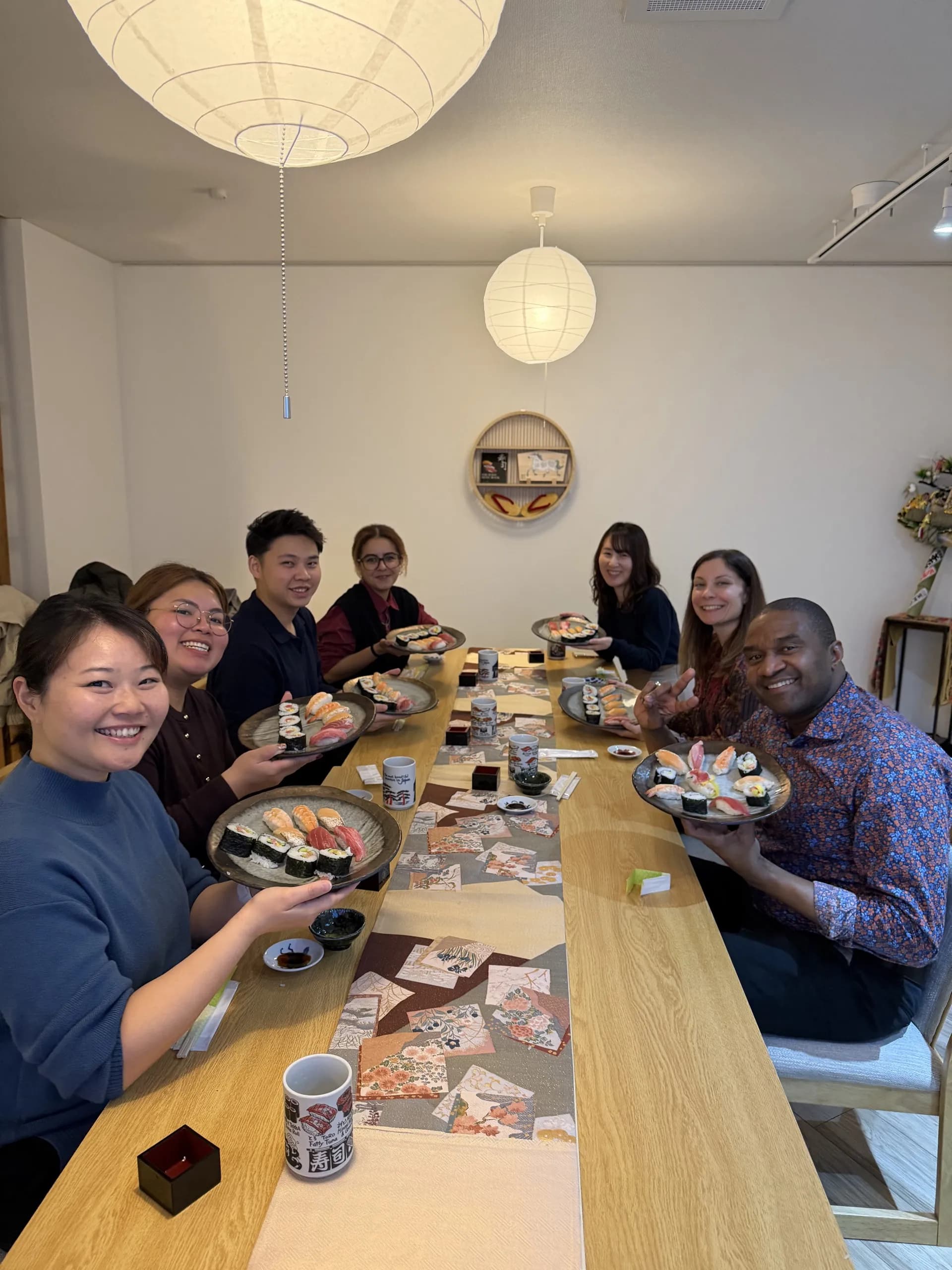 Group of guests enjoying sushi making experience