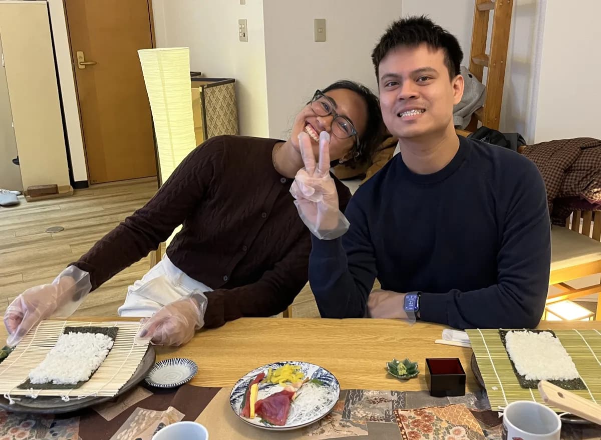 Couple making sushi together