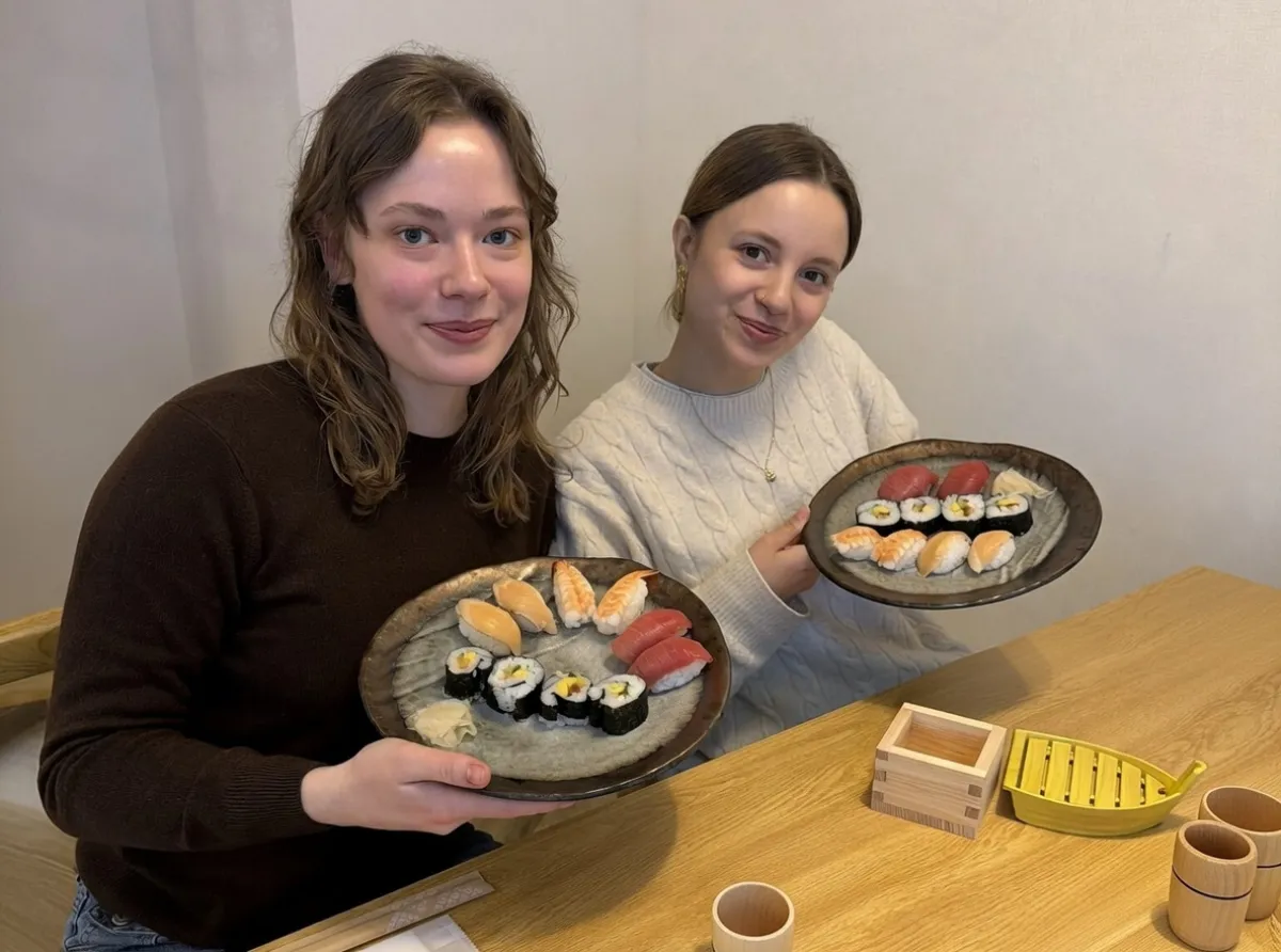 Friends enjoying their sushi creations